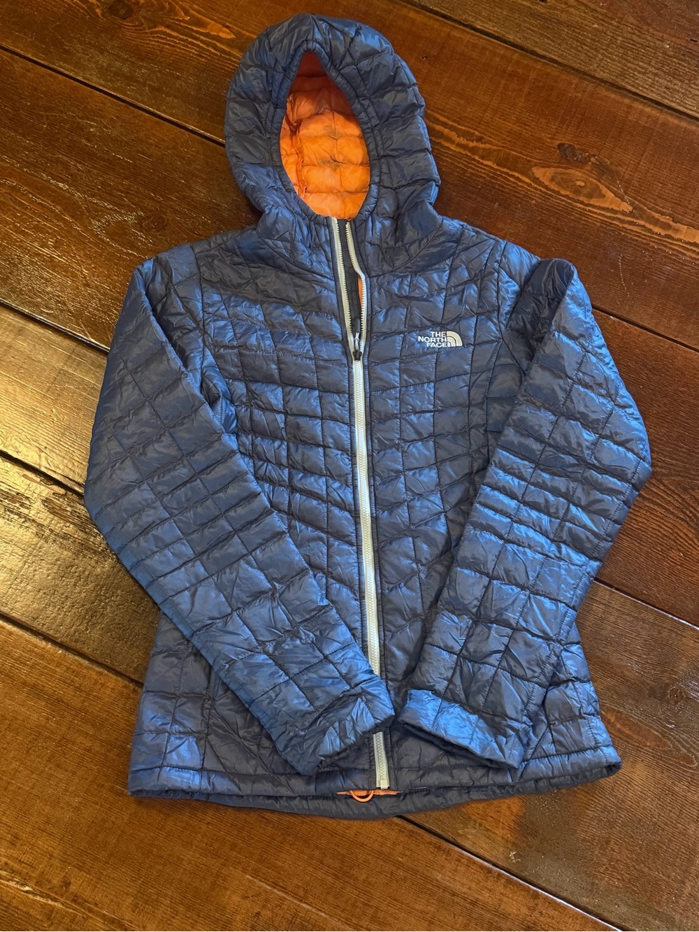The North Face Blue Quilted Hooded Jacket with Orange Lining